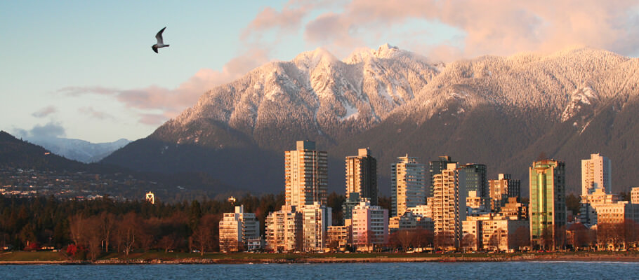 Vancouver west end at sunset with northshore mountains in the background